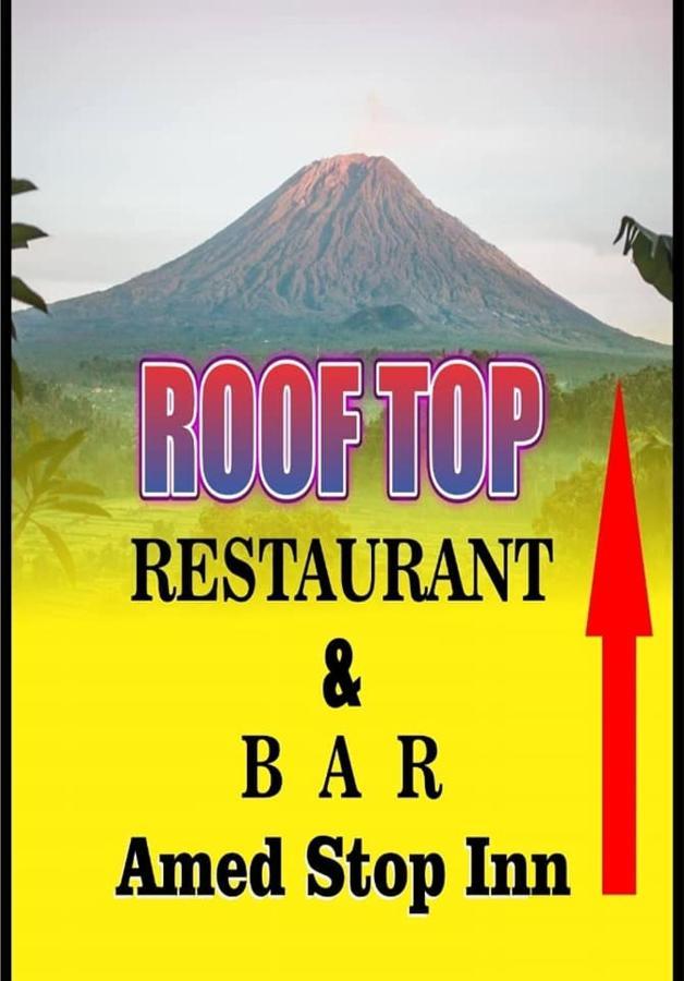 Amed Stop Inn Homestay, Rooftop Restaurant And Bar Exterior photo